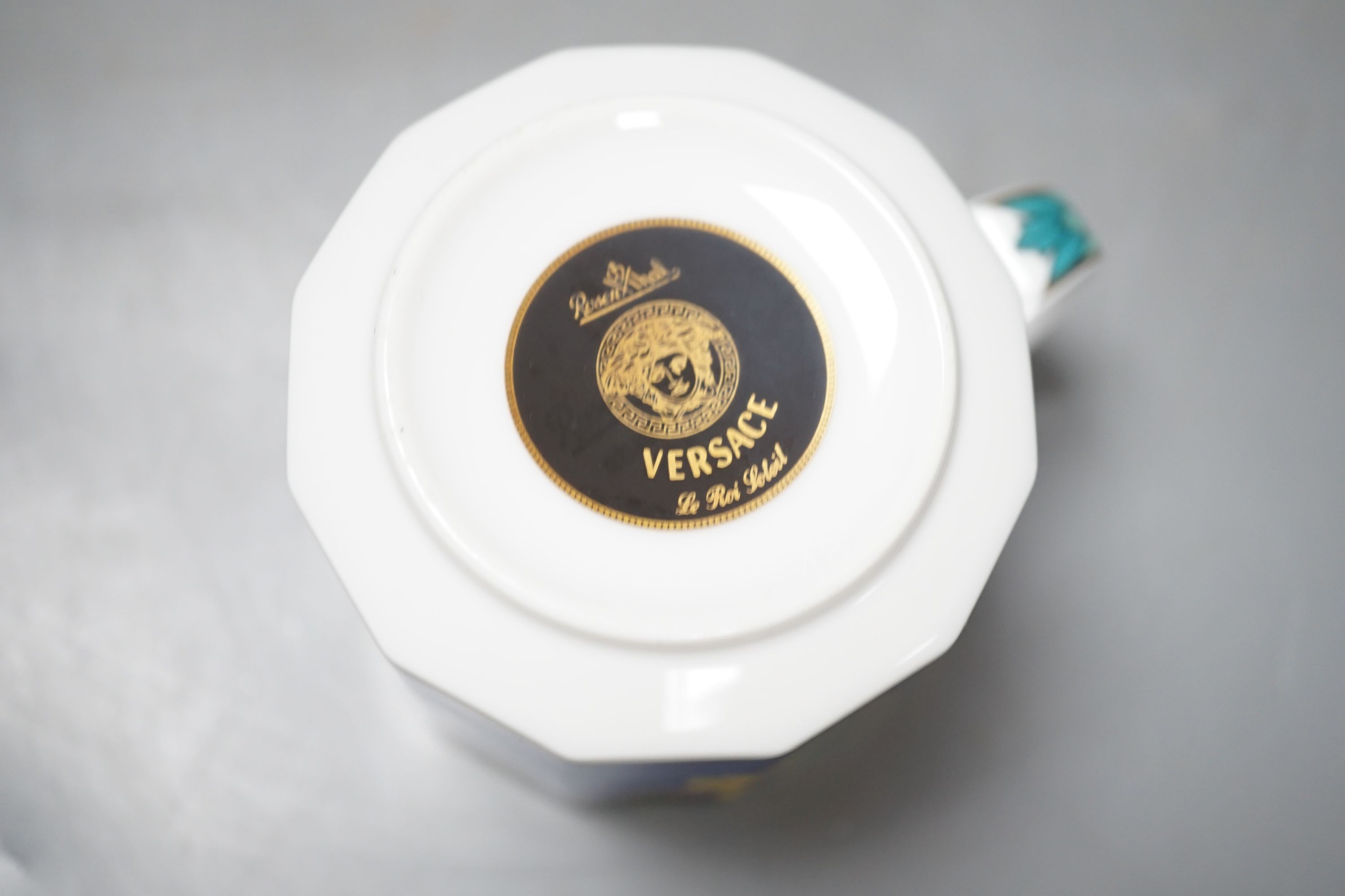 A set of eight Versace 'Le Roi Soleil' pattern cups and saucers